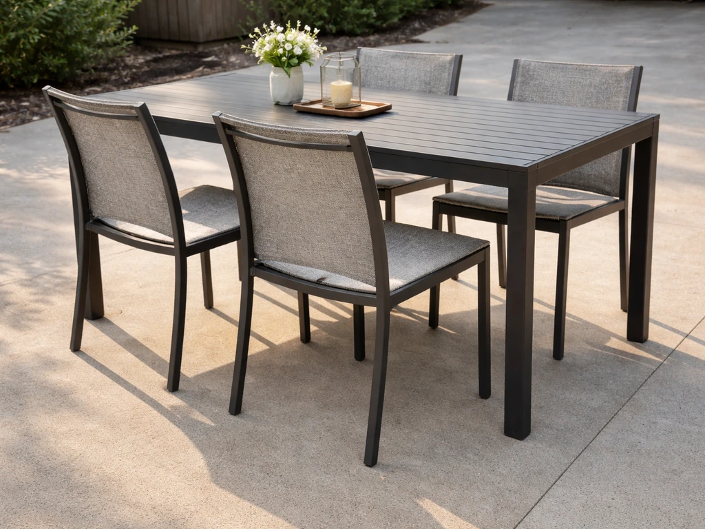 Patio dining chairs neatly spaced beside a table, showing comfortable placement and correct height.